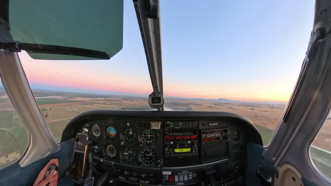 Golden hour flight in a general aviation aircraft over Northern California’s fields. Stunning rural terrain meets vibrant skies in this scenic sunset captured from above