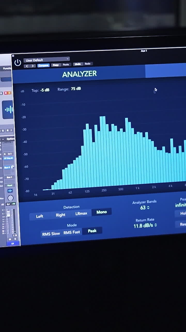 Screen switched on in the dark room for music recording. Equipment for professional music procession and creation. Vertical video