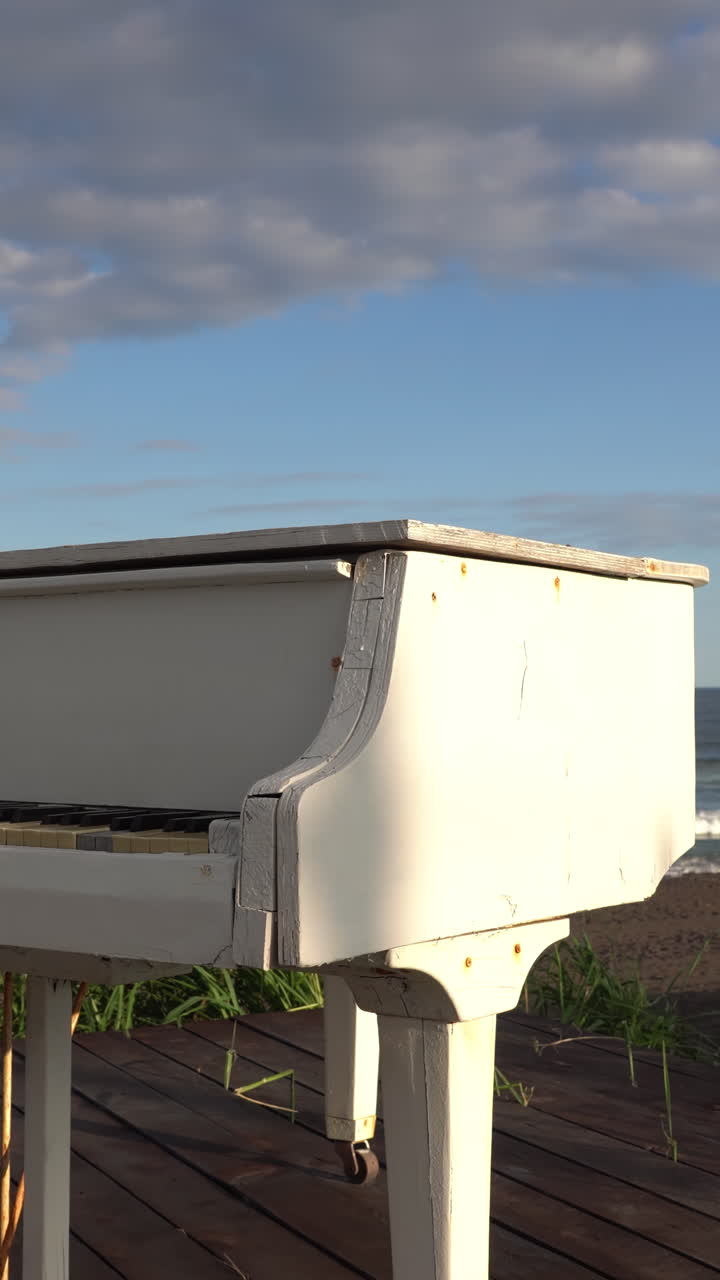 White Piano on a Beach at Sunset