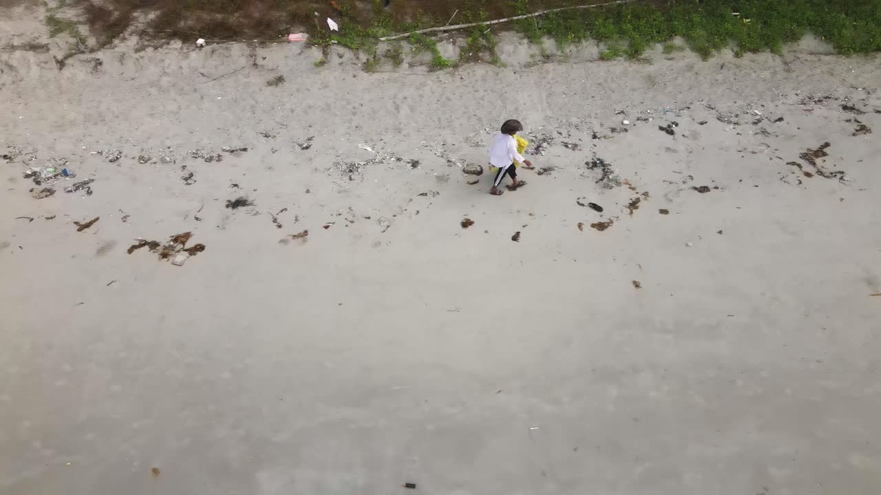 Volunteer Collecting Plastic Waste During Beach Clean-Up in Rayong Thailand Aerial View