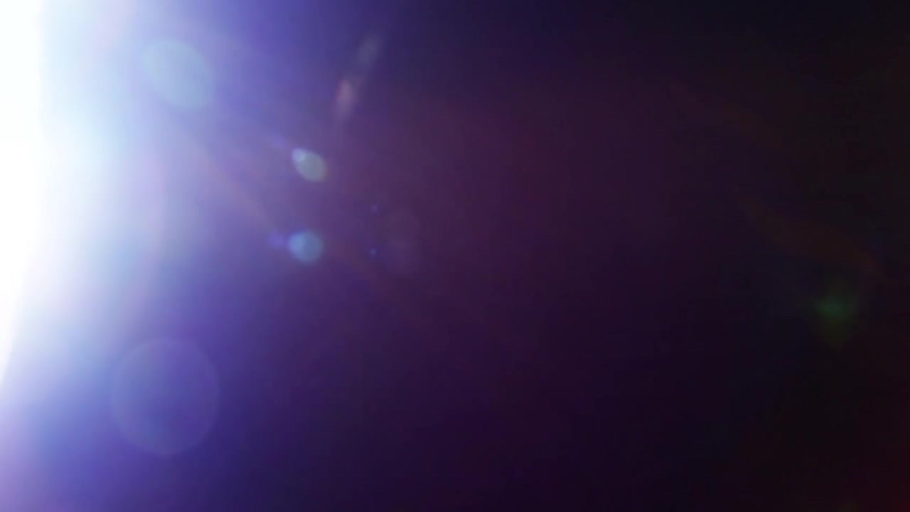 Efeito de Clarão de Luz Abstrato em Fundo Escuro