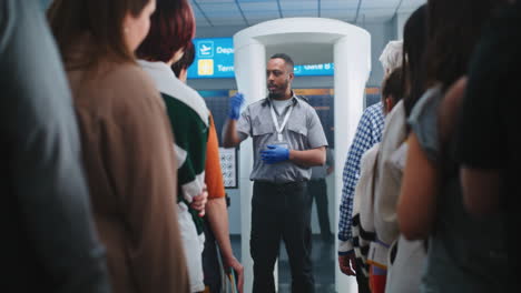 airport security personnel guiding passengers