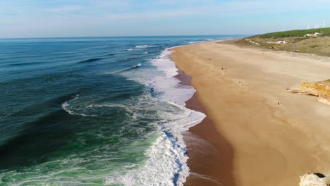 fly above famous beach of north in nazaré, portugal