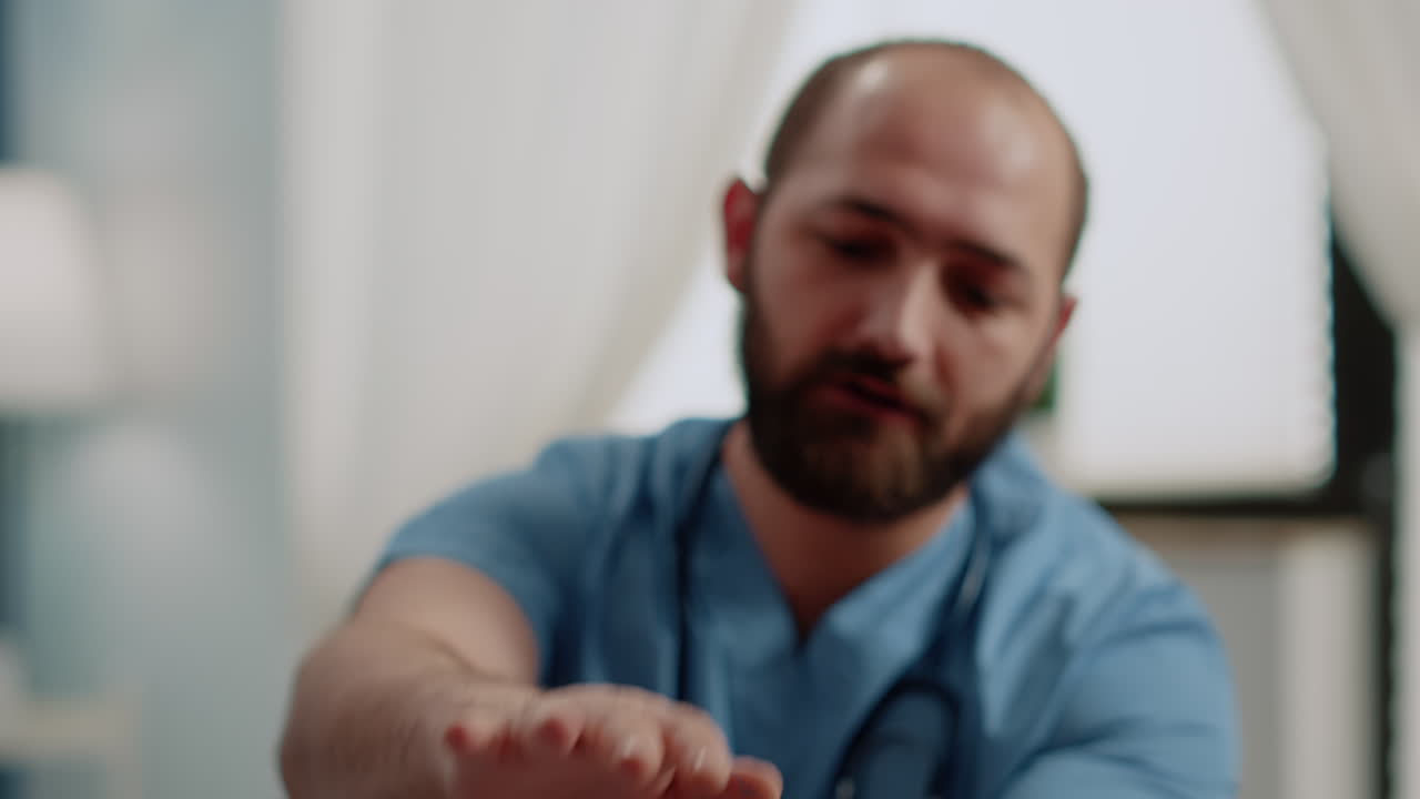 Close up of hand of patient holding dumbbells