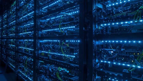 illuminated data center shelves filled with high-performance computing equipment, showcasing advanced technology and efficient design in a dark environment
