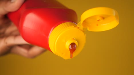 ketchup pouring from a bottle