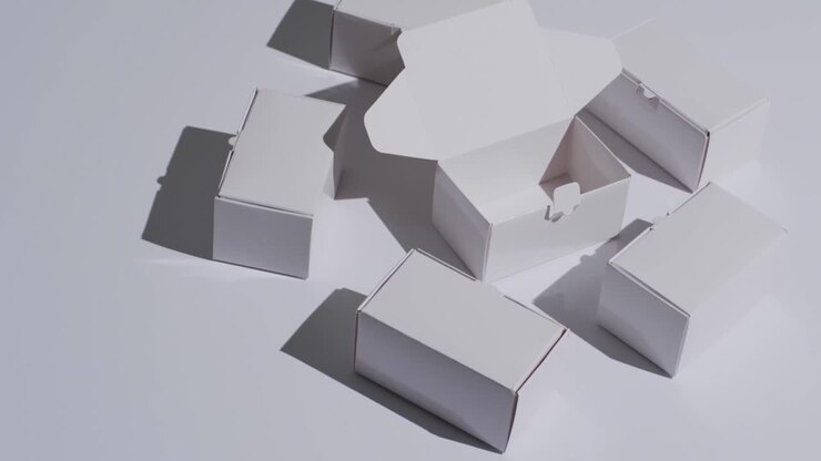 Video of white cardboard boxes with copy space over white background