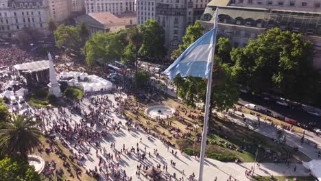 drone flying around argentinian flag waving in plaza de mayo during march lgbt event pride parade in buenos aires city