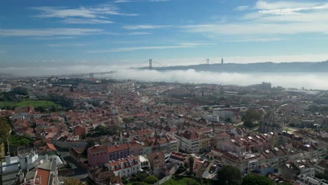 aerial perspective of the san francisco bay, where clouds envelop the iconic bridge, creating a mesmerizing scene in the usa