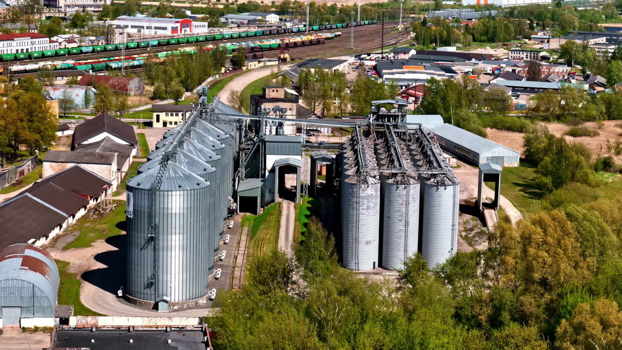 Industrial modern grain crop silo storage facility building facility, aerial drone view