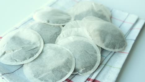 Tea-bags-and-yellow--mug-on-table