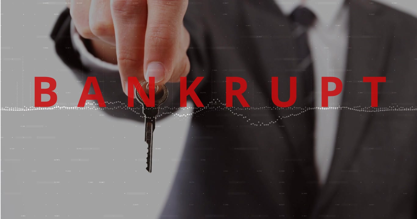 Suit-clad hand entering from left and extending key, red BANKRUPT overlay signaling financial loss