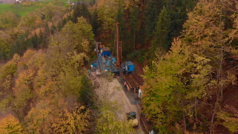 drilling operation for natural elements in the swiss fall forrest 30fps 4k