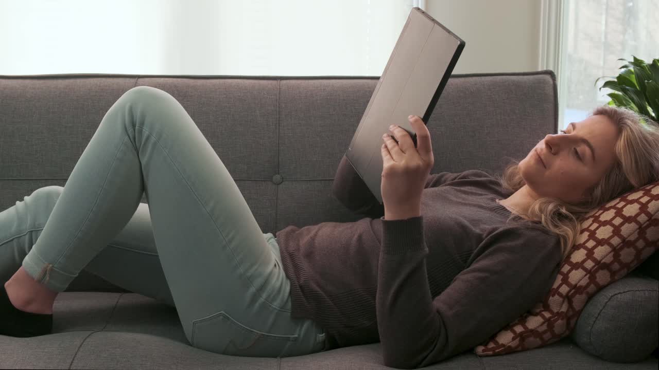 Young Millennial woman using a tablet