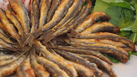 fried anchovies with salad