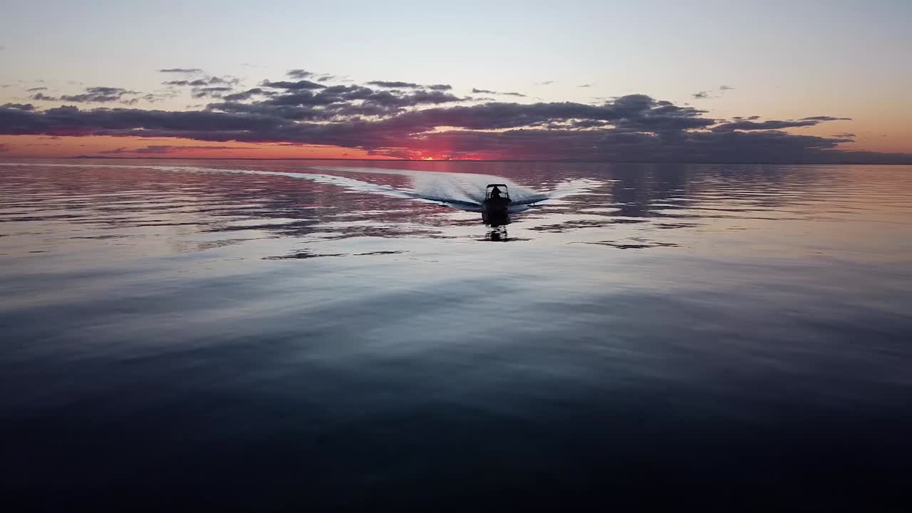 Boat on the Ocean at Sunset