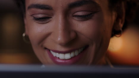 close up portrait attractive woman using tablet computer watching movie at night looking at screen enjoying entertainment online
