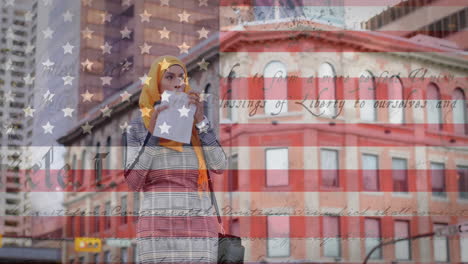 animation of american flag waving over biracial woman in hijab