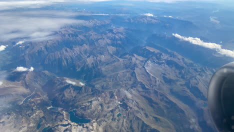 Flying-Over-Rocky-Valleys-With-Misty-Sky