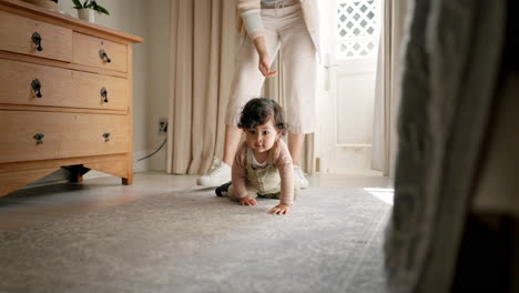 Baby,-crawling-and-support-from-mother-in-bedroom