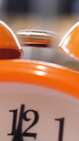 orange alarm clock close up