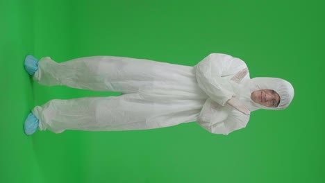 person in protective suit on green screen