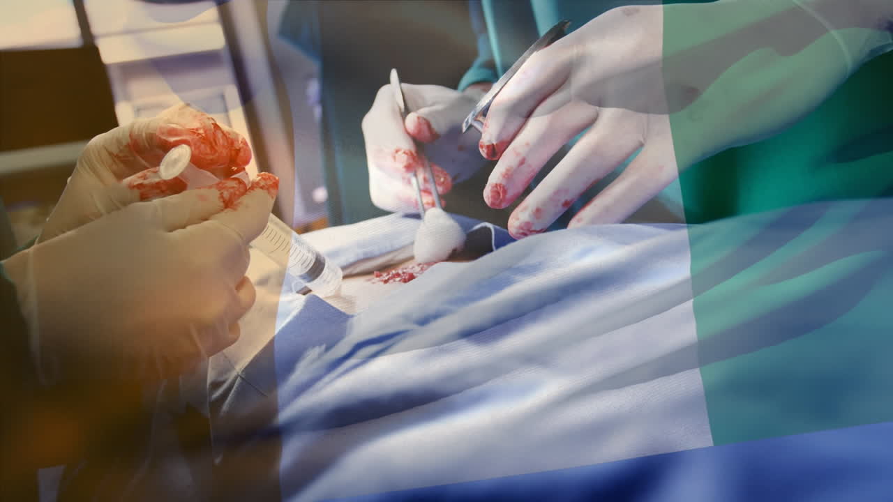 animación de la bandera de nigeria ondeando sobre los cirujanos en el quirófano