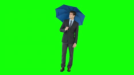 Young-businessman-sheltering-with-umbrella