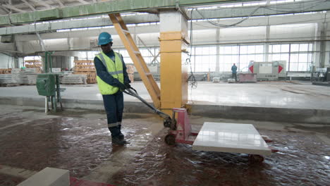 man transporting marble piece