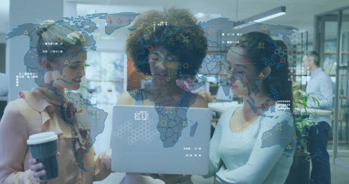 Three colleagues gazing at laptop showing world map fading in and preparing business presentation