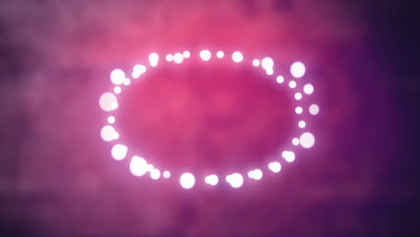 glowing oval of fairy lights on pink background