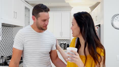 Man-kissing-woman-in-kitchen-4k