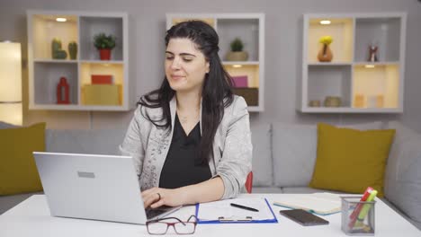 Home-office-worker-woman-looking-with-satisfied-expression.