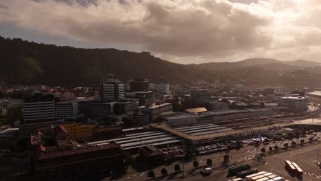 port area of wellington with boats and housing area in background. sunset time. aerial wide shot. residential apartment blocks in city of new zealand. dusk scene