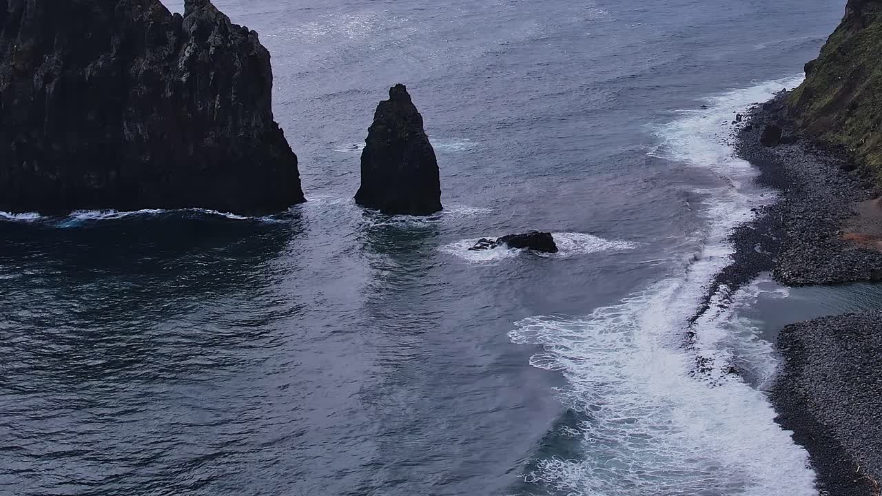 Coastal cliffs and waves of Madeira captured from a drone view