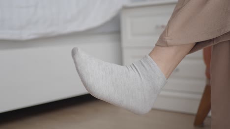 close up of a woman's foot wearing white socks