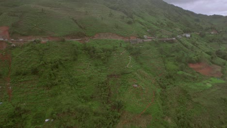 Sa-Pa-hills-approached-by-a-drone,-showing-one-side-of-the-hill-walk-road