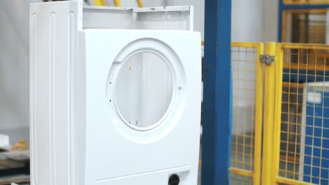 Assembly-washing-machine-on-robotic-equipment-at-industrial-factory