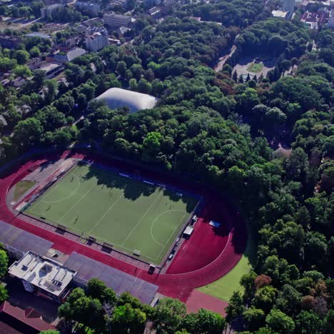 aerial view of a stadium and park in a city