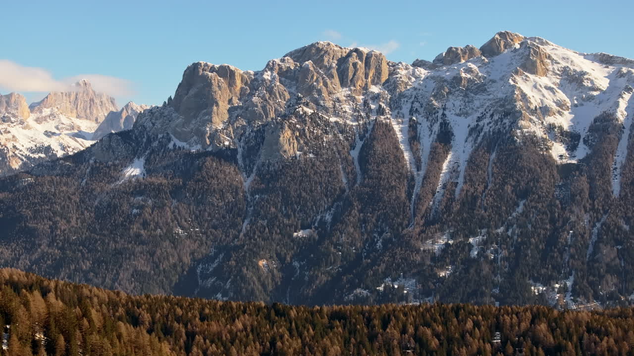 Aerial drone view of snow on the mountains in the Dolomites, Italy