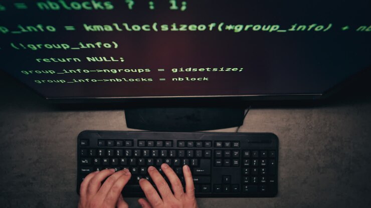 Person Programming at a Computer