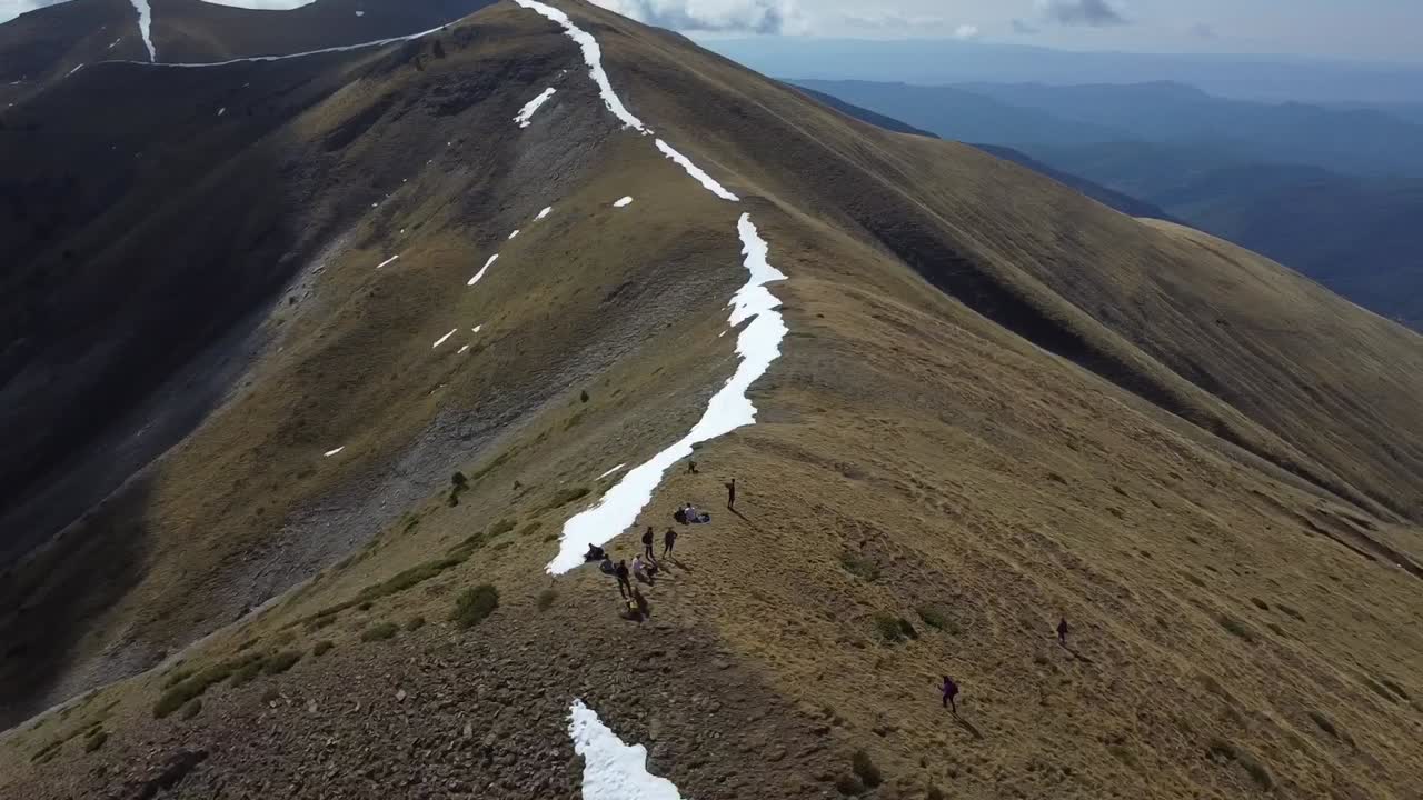 Group of hikers at the top of a mountain in the Spanish Pyrenees