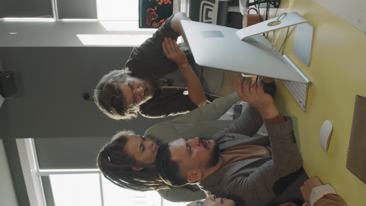 Vertical Shot of Team of Business Colleagues Discussing Project
