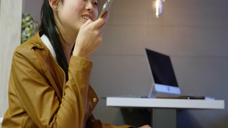 executive talking on mobile phone in office cafeteria 4k