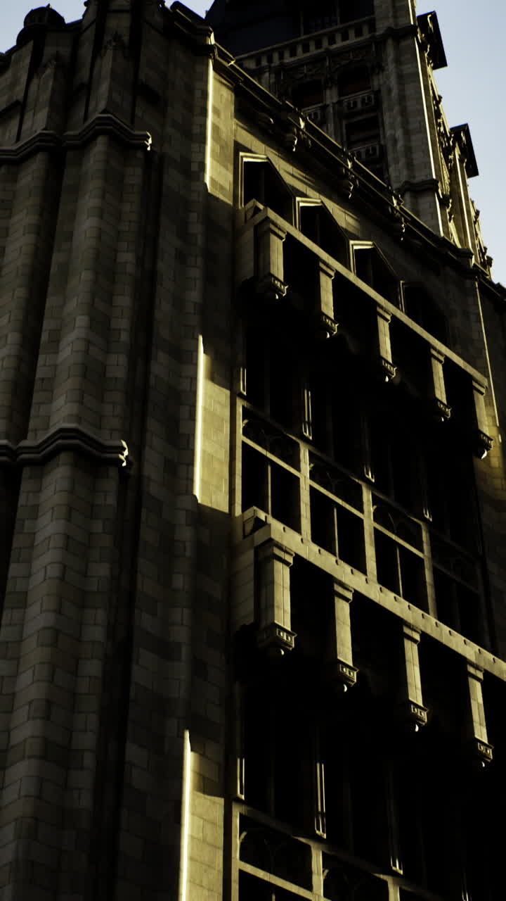 Historic building under dramatic sky during late afternoon light