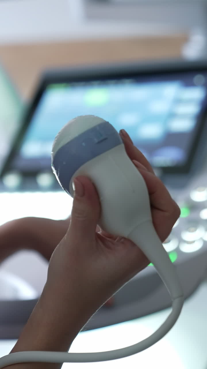 Hand holding ultrasound probe