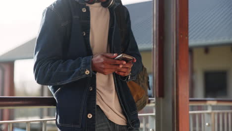 man using smartphone outdoors