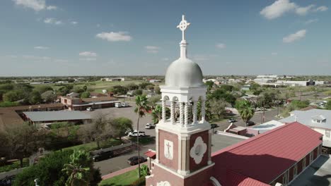 Aerial-view-of-"Our-Lady-of-Guadalup"-Church,-one-of-the-oldest-landmarks-in-Mission,-Texas,-dating-back-to-1899