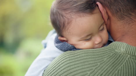 Family,-garden-and-a-baby-sleeping-on-dad-outdoor