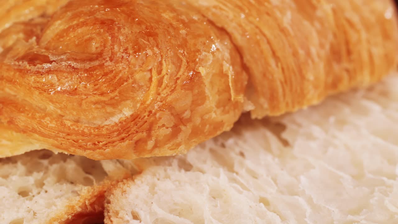 Croissant with jamon ham, Salmon, in Modern Cafe, Top View of Healthy Breakfast in Cafe. English breakfast: fried egg, bacon toast on sandwich.